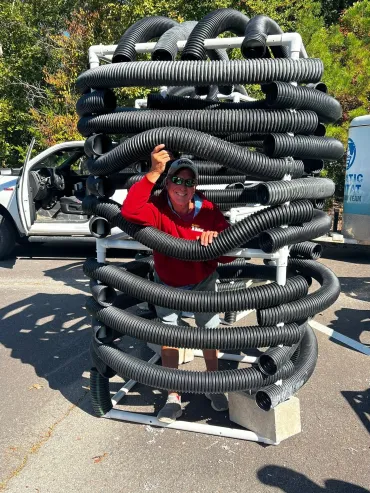 Outdoor installation with black coiled pipes