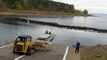 Construction equipment near a lake
