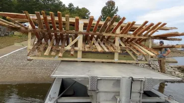Wood beams loaded onto a vehicle