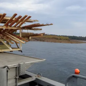 Boat with wooden structure on water