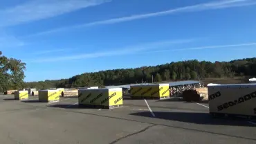 Lumber stacks in parking lot