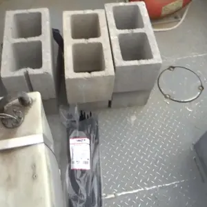 Concrete blocks and cables on metal floor