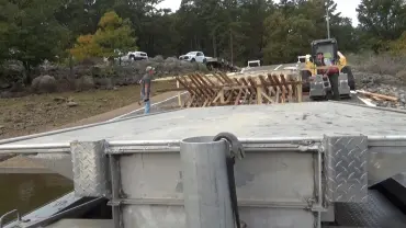 Workers building a wooden ramp