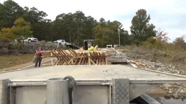 Workers assembling a bridge on site