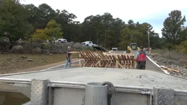 Construction site with workers and vehicles