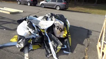 Crumpled plastic on asphalt surface