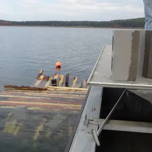 Orange buoy near wooden dock