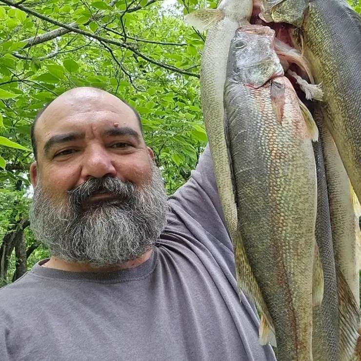 Fisherman displaying his catch proudly