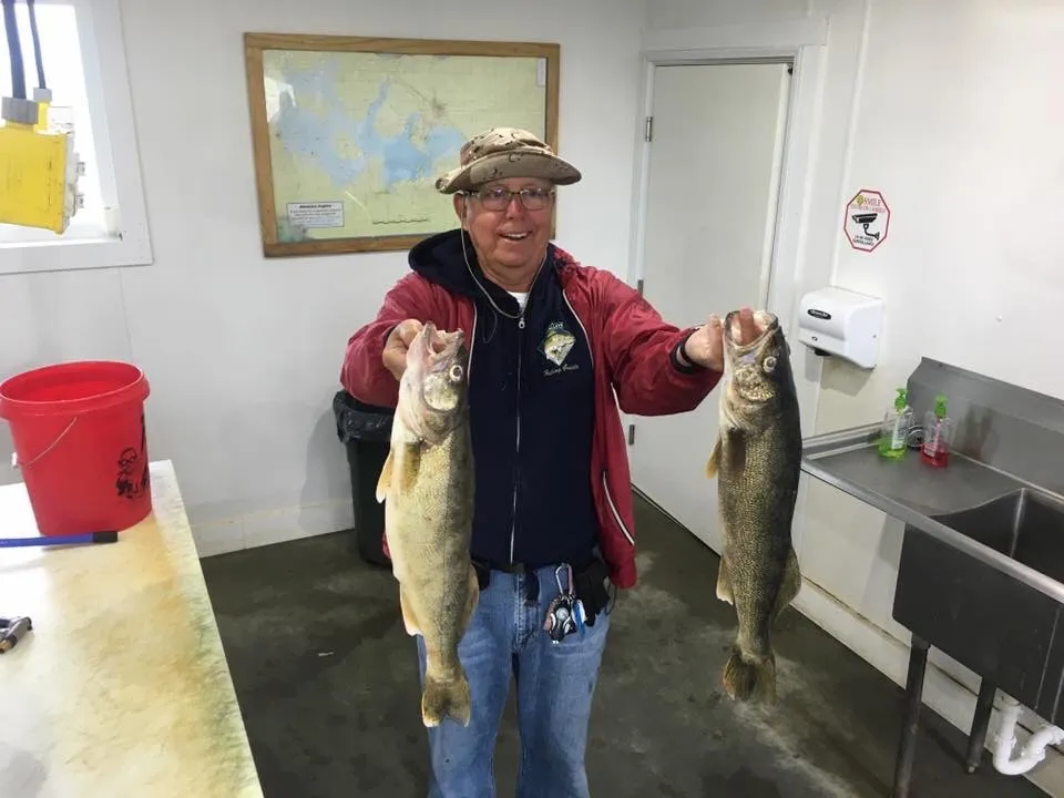 Fisherman displaying his fresh fish catch