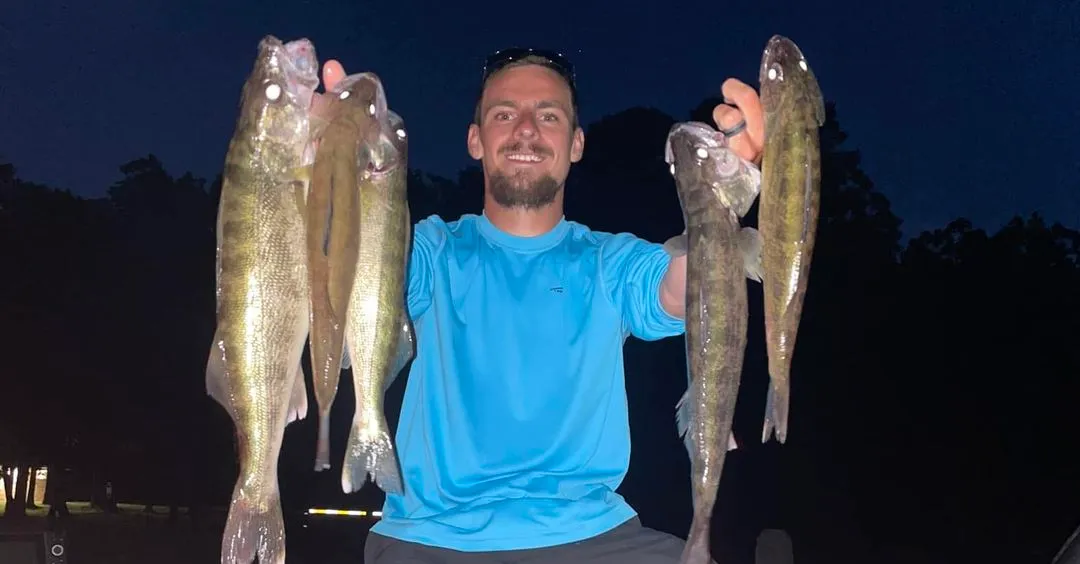 Fisherman displaying his catch proudly