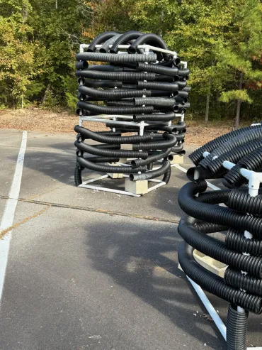 Industrial black hoses on pallets