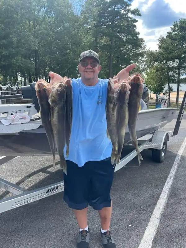 Fisherman displaying large catch